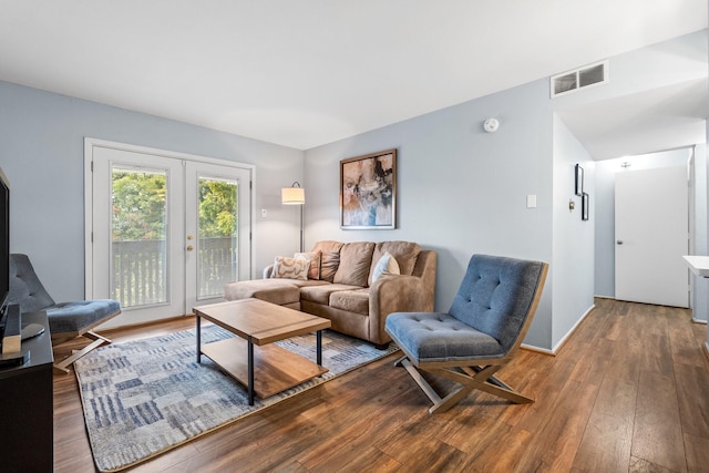 living room featuring hardwood / wood-style floors and french doors