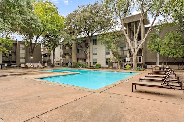 view of swimming pool with a patio area