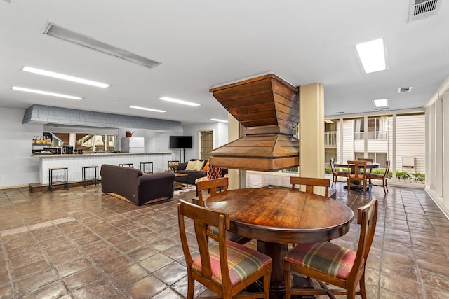 dining room with a wall of windows