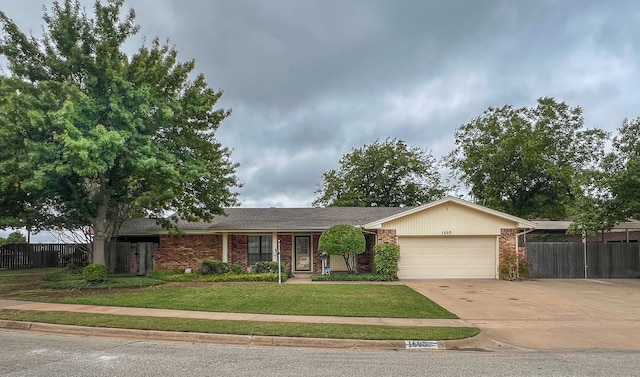 single story home featuring a garage and a front lawn