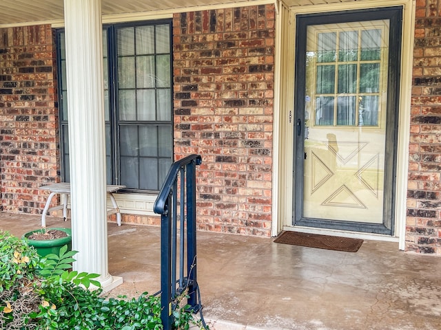 property entrance with covered porch