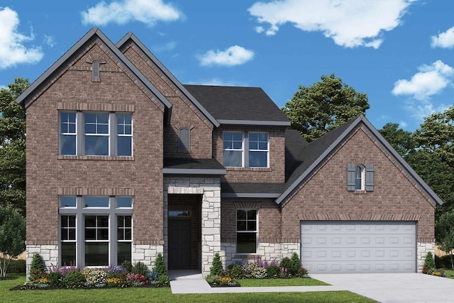 view of front of property featuring a front yard and a garage