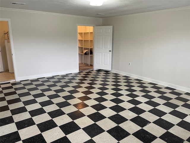 unfurnished room with crown molding