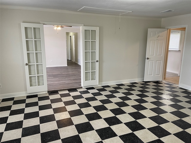 unfurnished room featuring french doors and ornamental molding