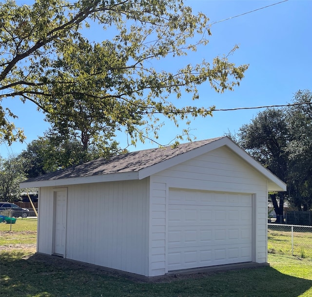 garage featuring a lawn