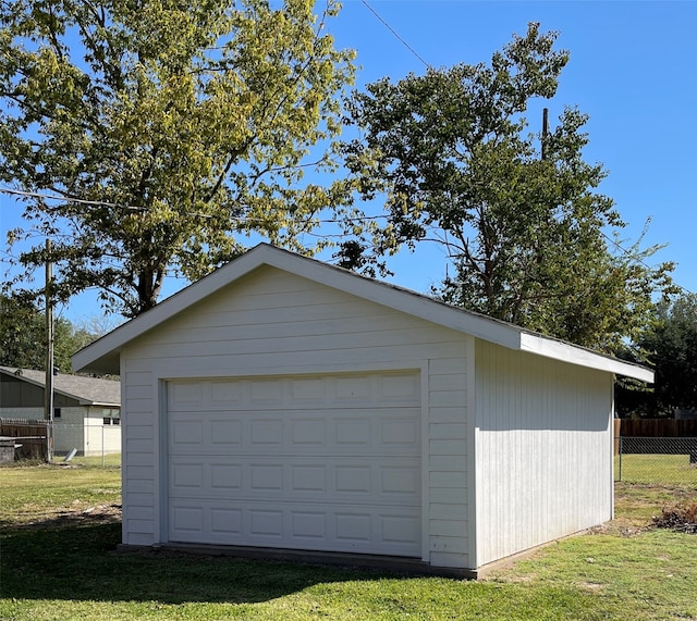 garage with a yard