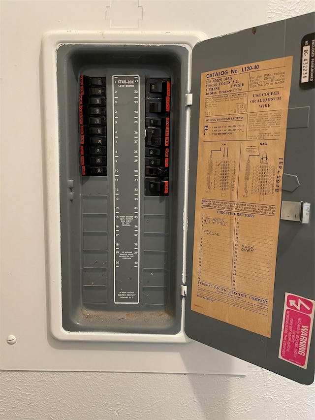 utility room featuring electric panel