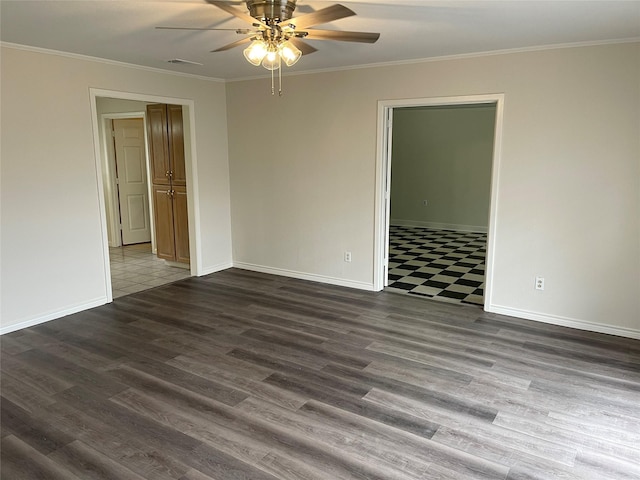 empty room featuring dark hardwood / wood-style flooring, ceiling fan, and crown molding