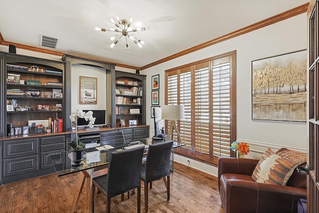 office space featuring a notable chandelier, wood-type flooring, and ornamental molding