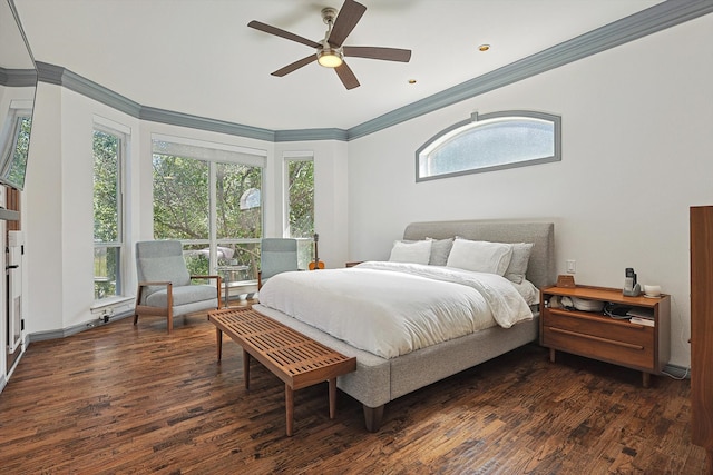 bedroom with ornamental molding, dark hardwood / wood-style floors, and ceiling fan