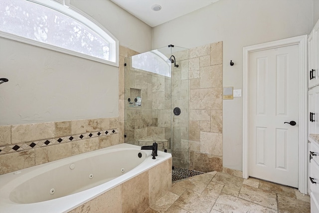 bathroom featuring vanity and separate shower and tub