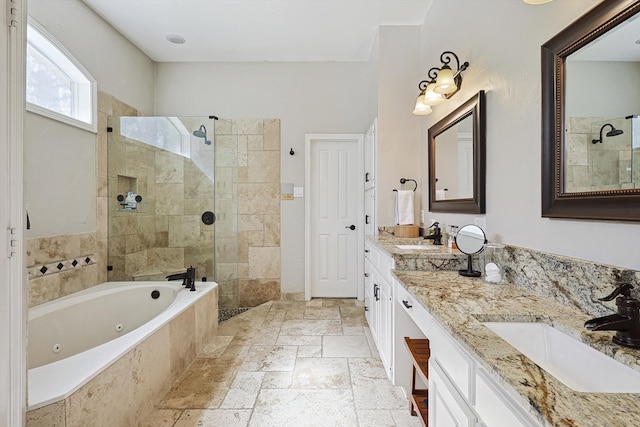 bathroom with vanity and independent shower and bath