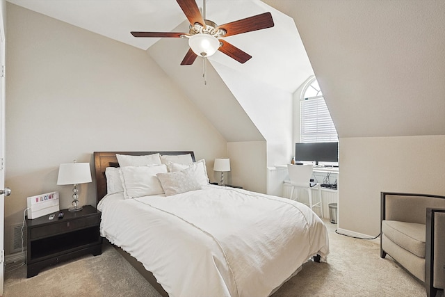 carpeted bedroom featuring lofted ceiling and ceiling fan