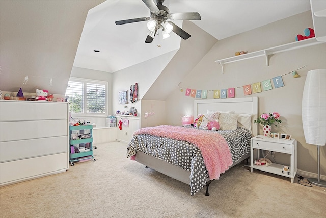 carpeted bedroom featuring ceiling fan and vaulted ceiling