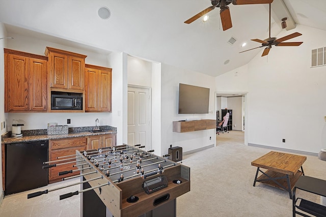 kitchen with black appliances, light carpet, high vaulted ceiling, and ceiling fan