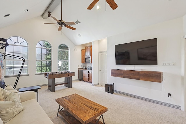 living room featuring beam ceiling, high vaulted ceiling, light colored carpet, and ceiling fan