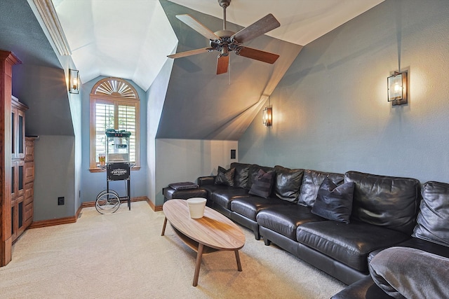 carpeted living room featuring ceiling fan and vaulted ceiling