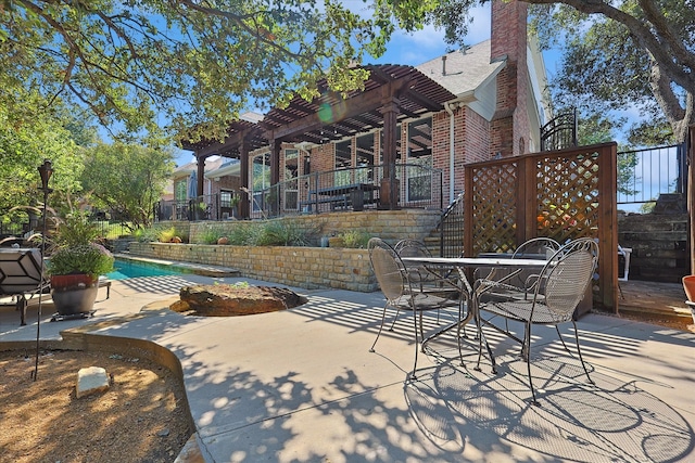 view of patio featuring a pergola