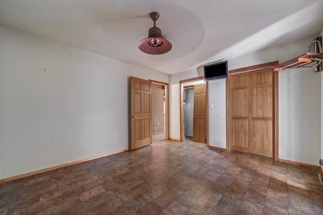 unfurnished bedroom with ceiling fan