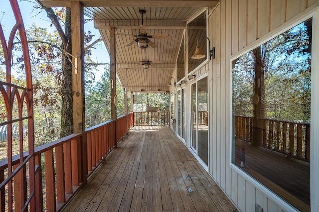 wooden deck featuring ceiling fan