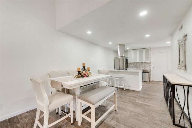 11306 Park Central Pl Unit D, Dallas, TX 75230 - dining space featuring recessed lighting and light wood-style flooring