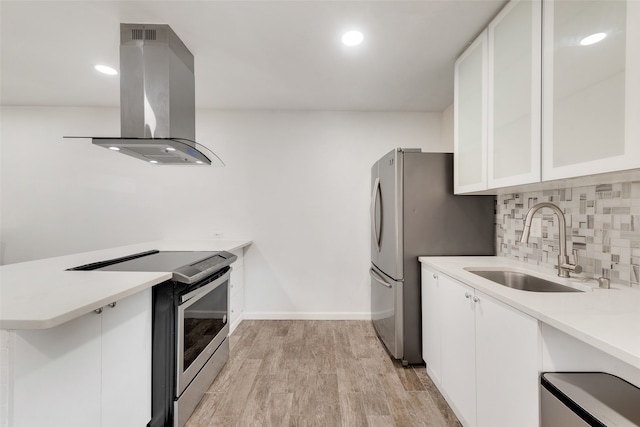 kitchen featuring exhaust hood, light hardwood / wood-style flooring, stainless steel appliances, sink, and white cabinetry