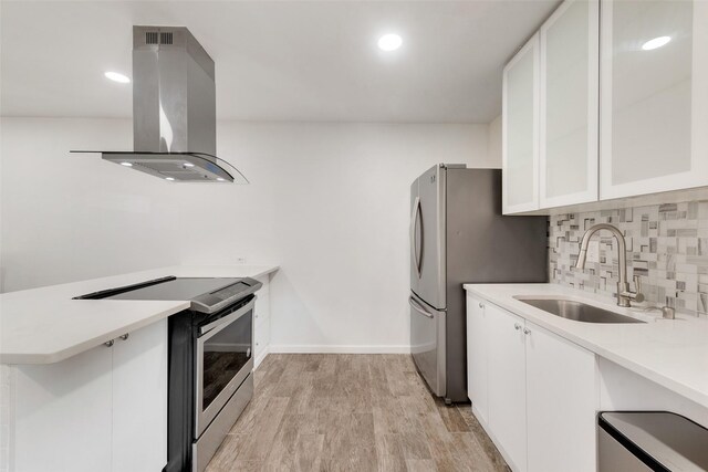 11306 Park Central Pl Unit D, Dallas, TX 75230 - kitchen with island range hood, stainless steel appliances, a sink, white cabinets, and recessed lighting