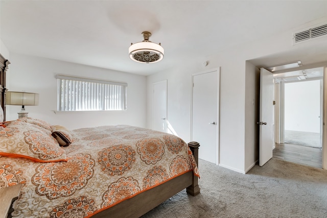 bedroom with ceiling fan and carpet floors