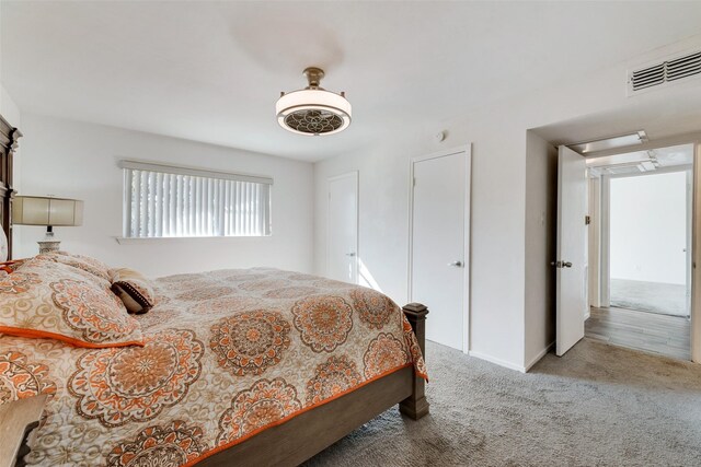 11306 Park Central Pl Unit D, Dallas, TX 75230 - bedroom featuring carpet, a ceiling fan, baseboards, and attic access