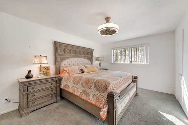 bedroom with light carpet and ceiling fan