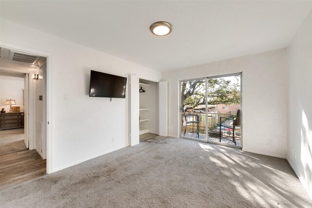 11306 Park Central Pl Unit D, Dallas, TX 75230 - unfurnished living room featuring carpet and baseboards
