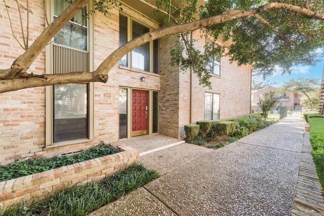 11306 Park Central Pl Unit D, Dallas, TX 75230 - view of exterior entry with brick siding