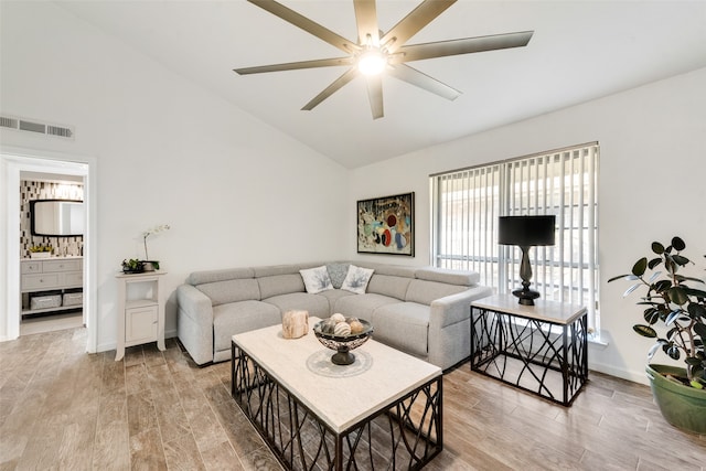 living room with light hardwood / wood-style floors and ceiling fan