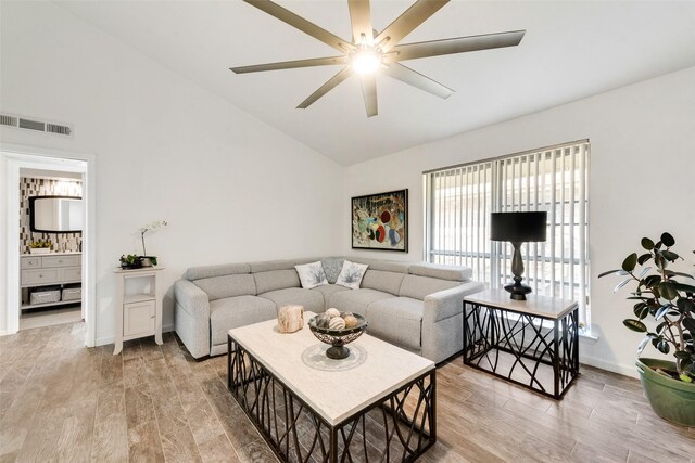 11306 Park Central Pl Unit D, Dallas, TX 75230 - living area featuring a ceiling fan, light wood-type flooring, baseboards, and high vaulted ceiling