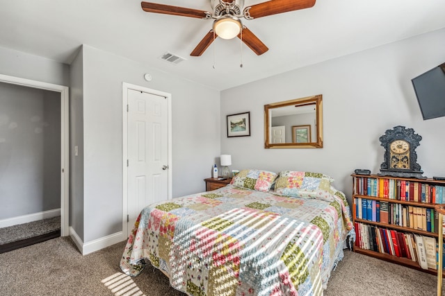 carpeted bedroom with ceiling fan