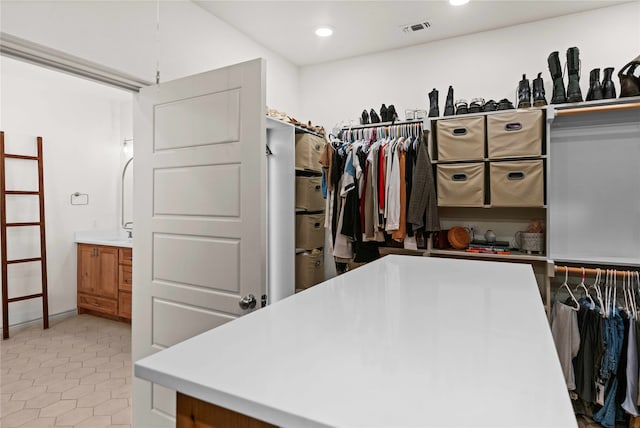 walk in closet featuring light tile patterned floors