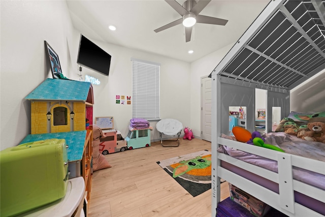 bedroom with wood-type flooring and ceiling fan