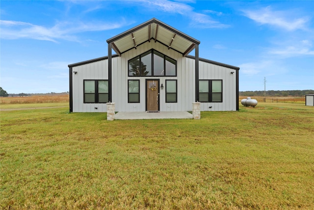 rear view of house with a lawn