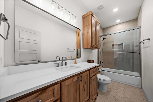 950 Vz County Road 1604, Grand Saline, TX 75140 - bathroom featuring toilet, vanity, bath / shower combo with glass door, recessed lighting, and tile patterned floors
