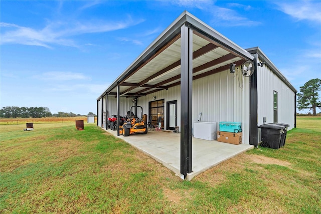 view of outbuilding with a yard