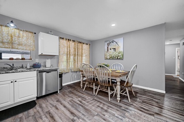 dining room featuring hardwood / wood-style flooring and sink