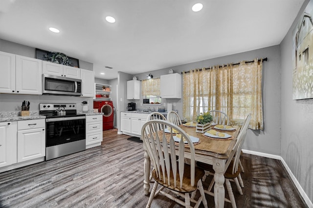 dining room featuring sink and light wood-type flooring