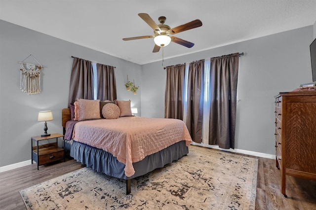 bedroom featuring ceiling fan and hardwood / wood-style flooring