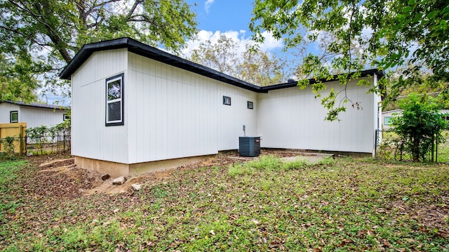 rear view of property featuring central air condition unit