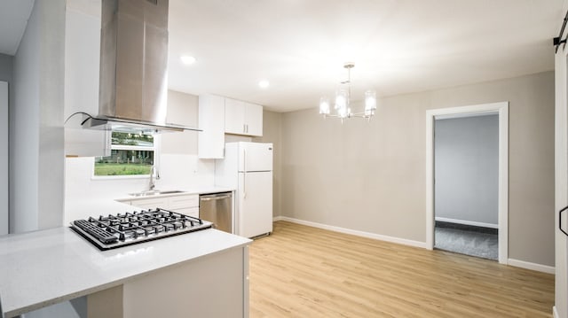 kitchen featuring island range hood, white cabinetry, appliances with stainless steel finishes, sink, and light hardwood / wood-style floors