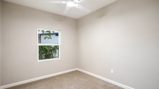 carpeted empty room featuring ceiling fan