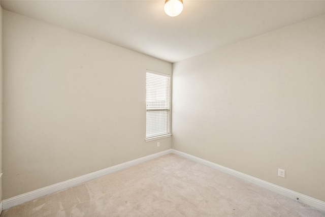 empty room featuring light colored carpet