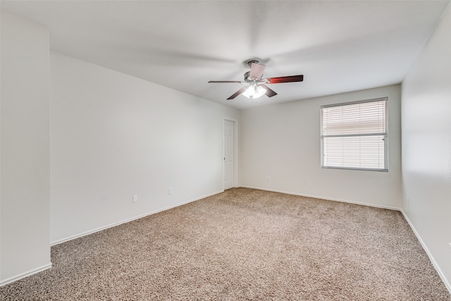 empty room with carpet floors and ceiling fan