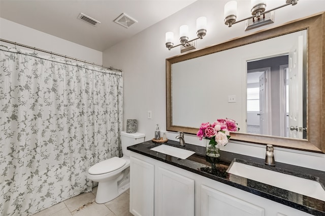 bathroom with vanity, toilet, a shower with curtain, and tile patterned flooring