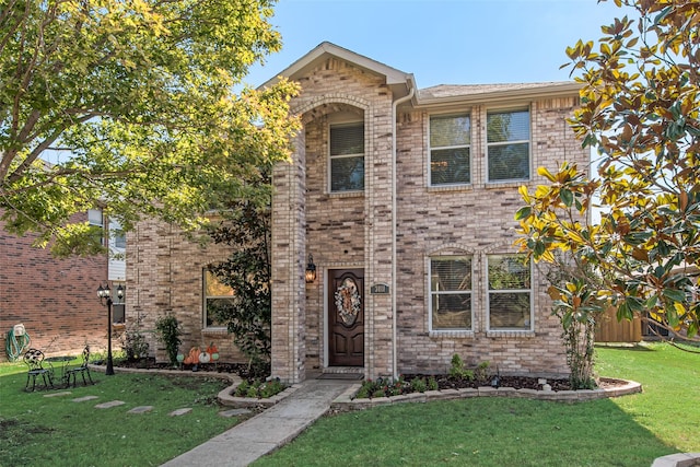 view of front of home with a front lawn